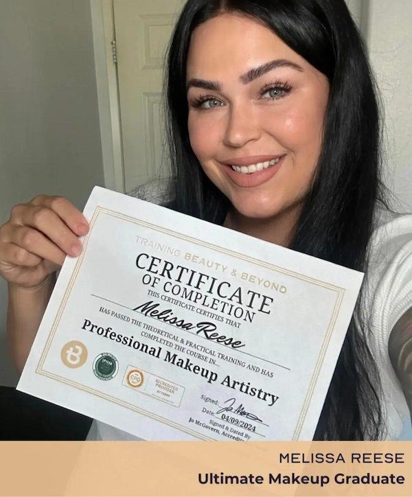 Woman holding Professional Makeup Artistry Certificate