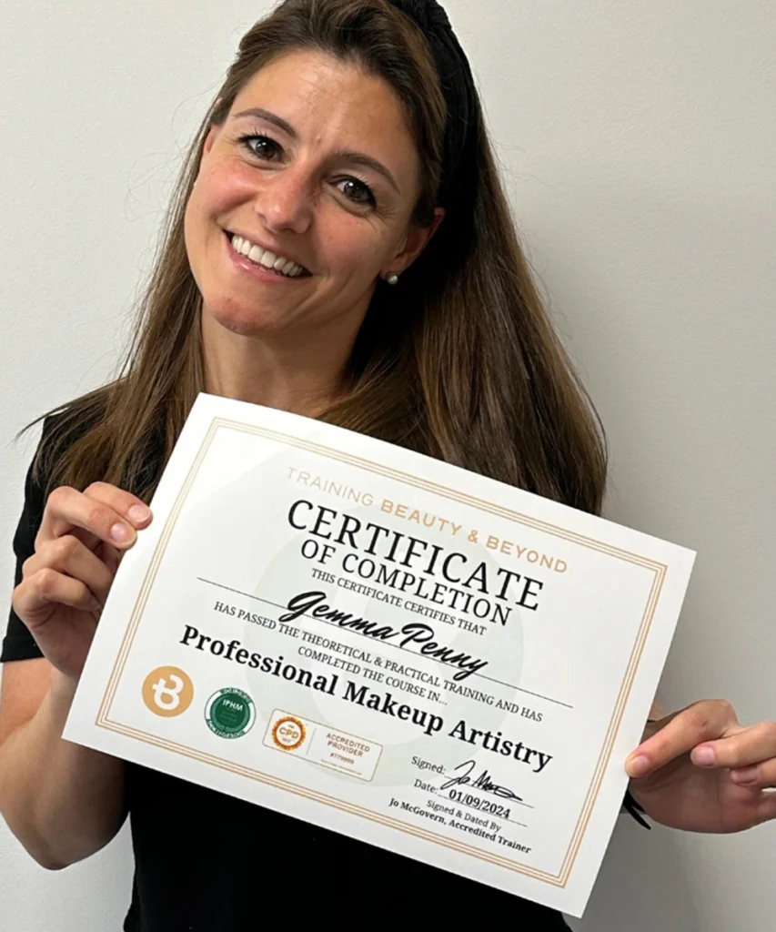 Student Gemma holding her Accredited makeup Certificate